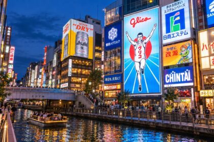 AI-generated photo-style illustration of Dotonbori Canal at blue hour, with the Glico running-man sign and colorful reflections in the water.