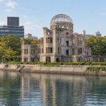 AI-generated illustration of the Atomic Bomb Dome beside the Motoyasu River in present-day Hiroshima.