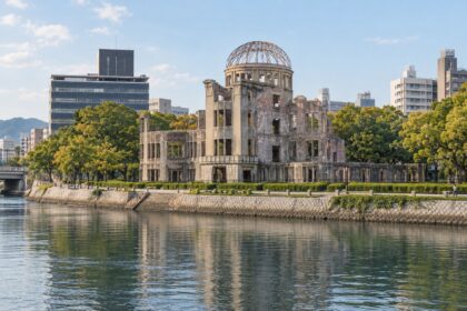 AI-generated illustration of the Atomic Bomb Dome beside the Motoyasu River in present-day Hiroshima.