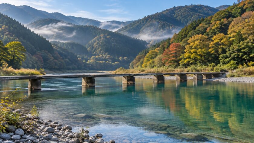 AI-generated illustration of a low concrete bridge crossing a clear blue-green river below forested hills, inspired by the Shimanto River in Kochi.