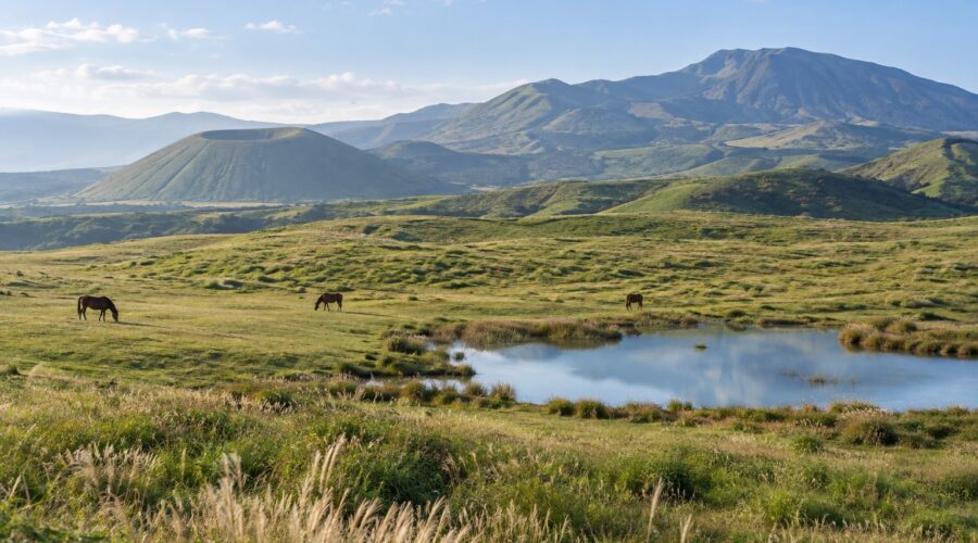 AI-generated illustration of grazing horses, a reflective pond and rolling volcanic grasslands, inspired by Aso in Kumamoto.