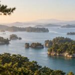 AI-generated illustration of pine-covered islands in calm blue water, inspired by Matsushima Bay, Miyagi.