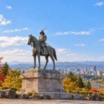 AI-generated illustration inspired by the bronze equestrian monument of Date Masamune, overlooking Sendai in autumn.