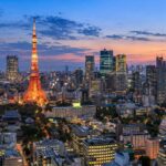 AI-generated illustration of Tokyo Tower and a city skyline at blue hour